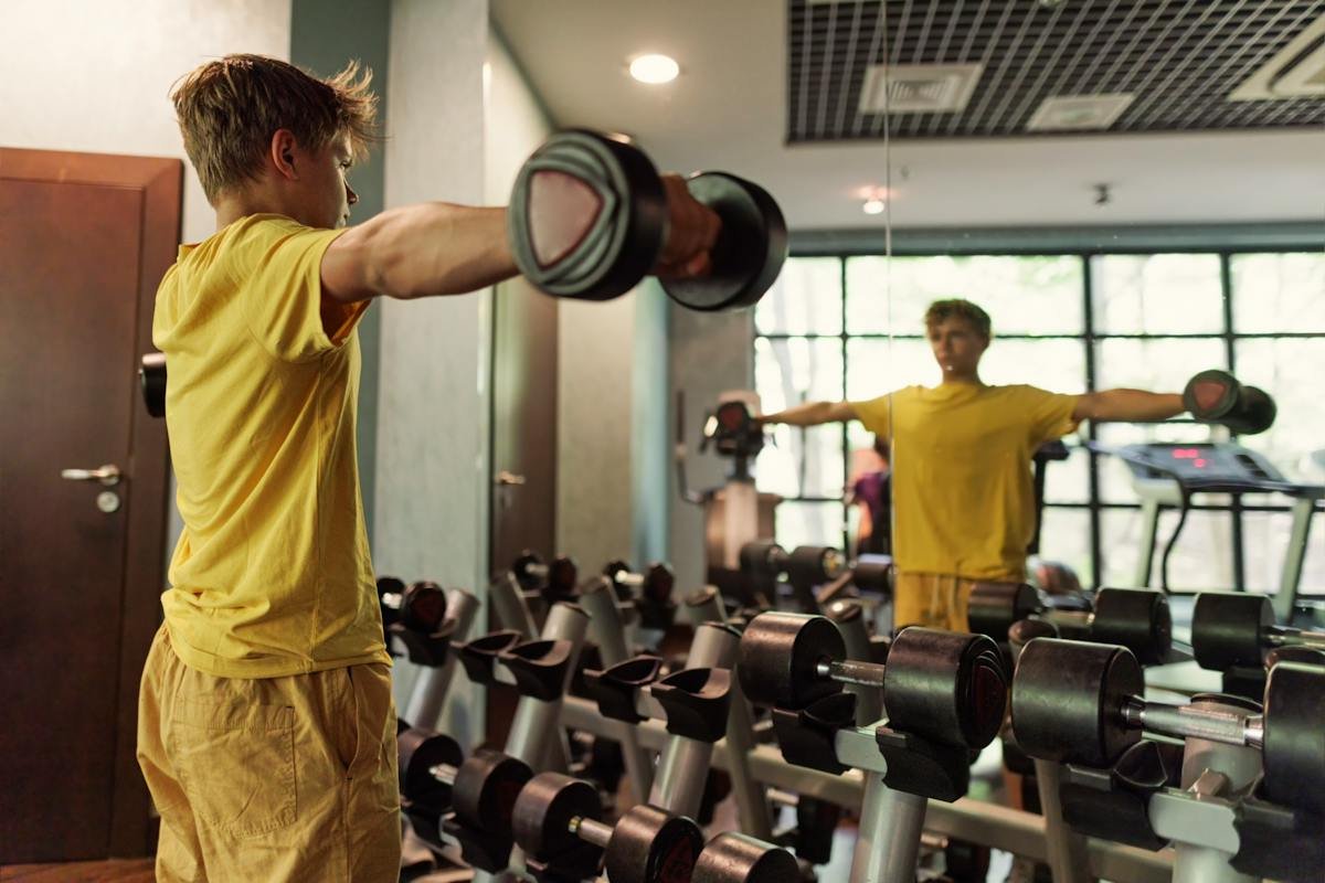 Person lifting dumbbells in a gym