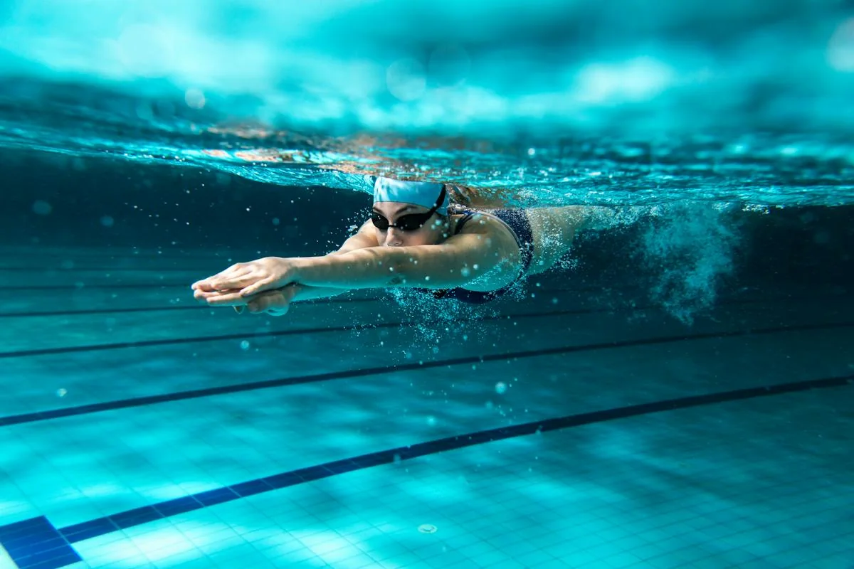 A swimmer moving through a swimming pool.
